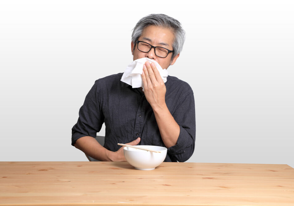 The,Senior,Asian,Man,Eating,Noodle,On,The,White,Background.