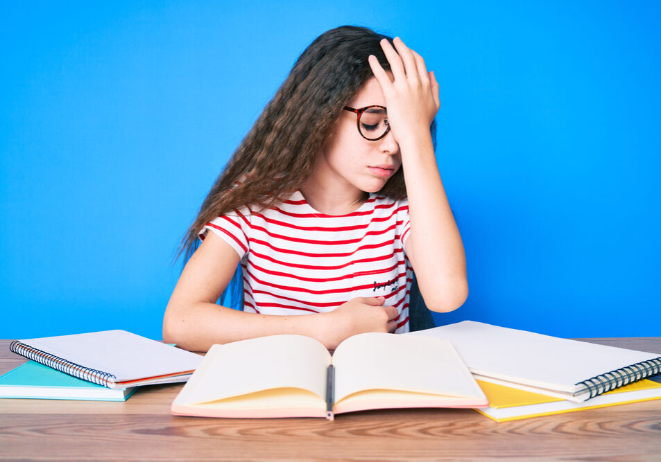 Cute,Hispanic,Child,Girl,Studying,For,School,Exam,Sitting,On