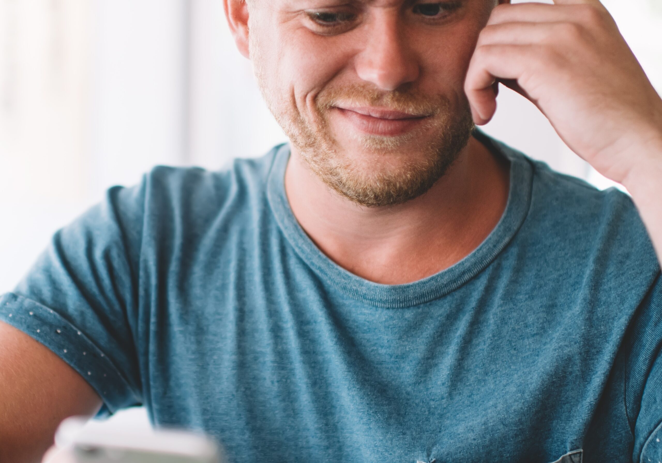 man looking confused at his phone