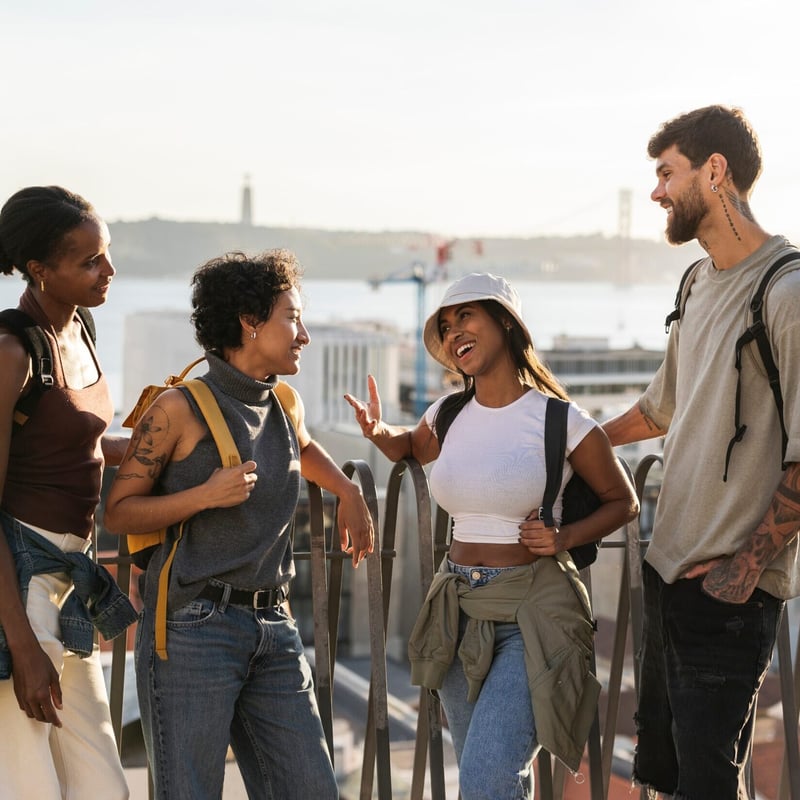 group of friends talking, overlooking the city of Lisbon and the river Tejo